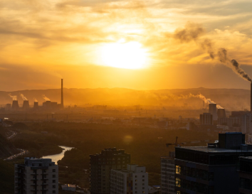 Sunrise in the distance, possibly buildings in the foreground